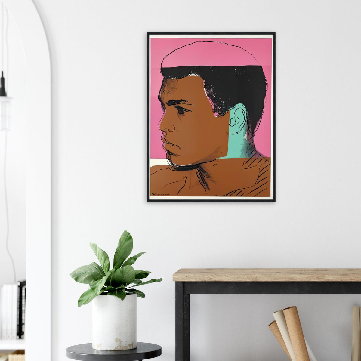 Andy Warhol framed print depicting ali appears in profile against coral-pink colour; Warhol draws the hairline back into a partly obscured photographic silhouette; The Muhammad Ali portfolio was developed from Warhol’s photographs of the celebrated boxer after sports