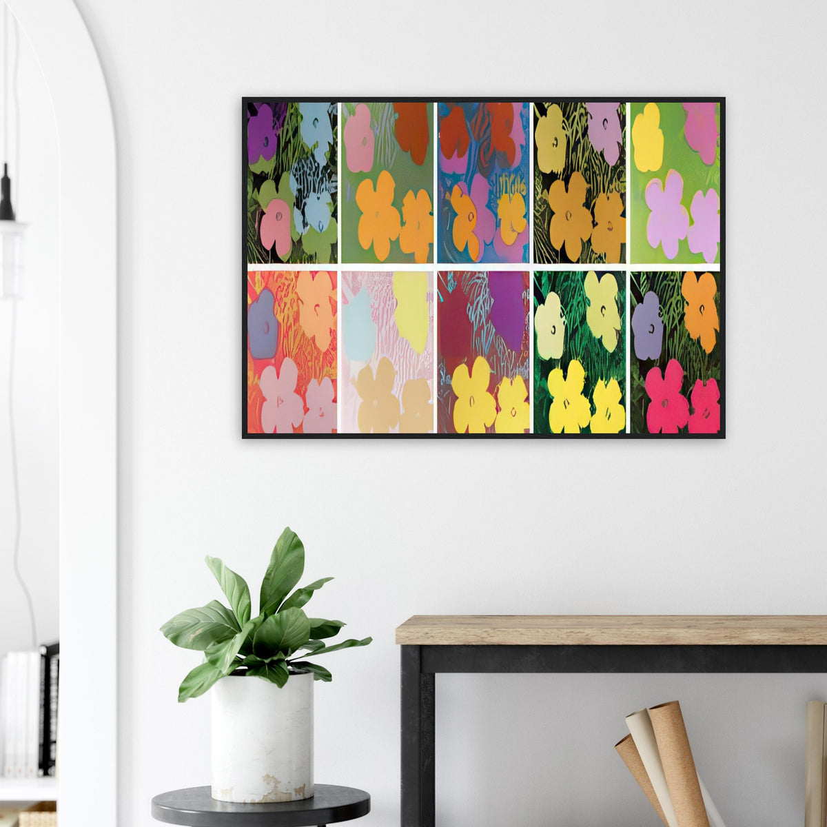 Andy Warhol framed print depicting repeated hibiscus-like blossoms with simplified petals and strong silhouettes, a detail that connects the composition to its broader artistic subject