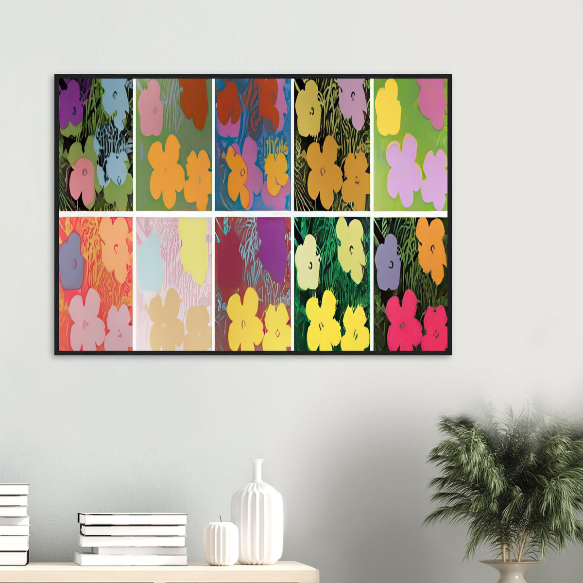 Andy Warhol framed print depicting repeated hibiscus-like blossoms with simplified petals and strong silhouettes, a detail that connects the composition to its broader artistic subject