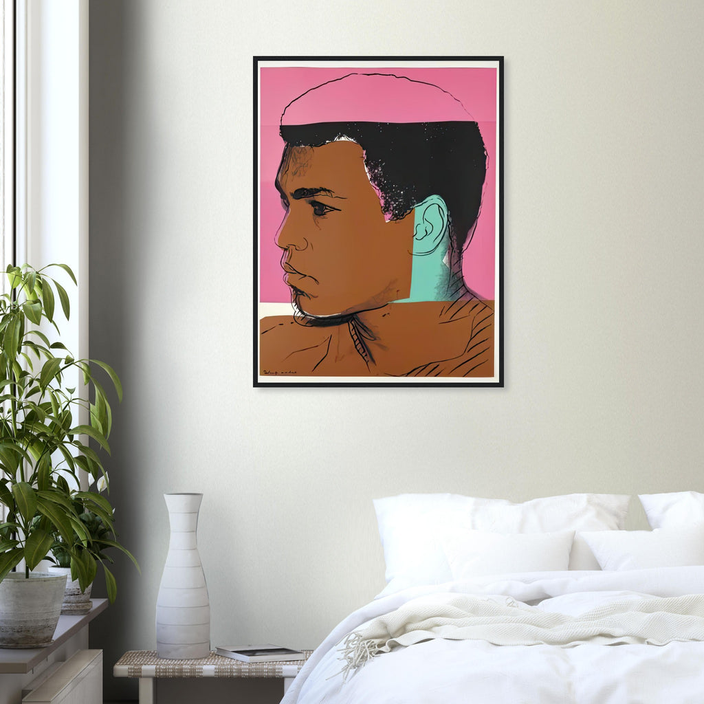 Andy Warhol framed print depicting ali appears in profile against coral-pink colour; Warhol draws the hairline back into a partly obscured photographic silhouette; The Muhammad Ali portfolio was developed from Warhol’s photographs of the celebrated boxer after sports