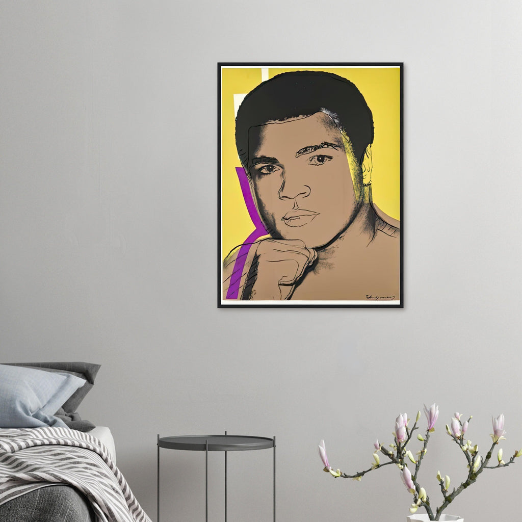 Andy Warhol framed print depicting ali turns toward the viewer with a raised fist; yellow, purple and white colour accents sharpen his focused gaze; The Muhammad Ali portfolio was developed from Warhol’s photographs of the celebrated boxer after sports