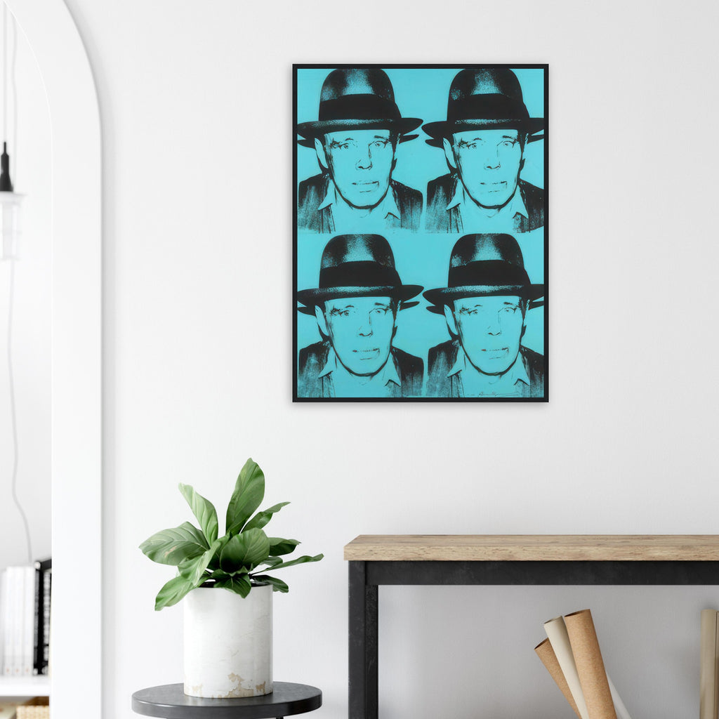 Andy Warhol framed print depicting a 2-by-2 arrangement repeats the felt-hatted face; black forms sit against cyan blue, producing a relatively restrained portrait; Warhol portrayed fellow artist Joseph Beuys after photographing him in 1979