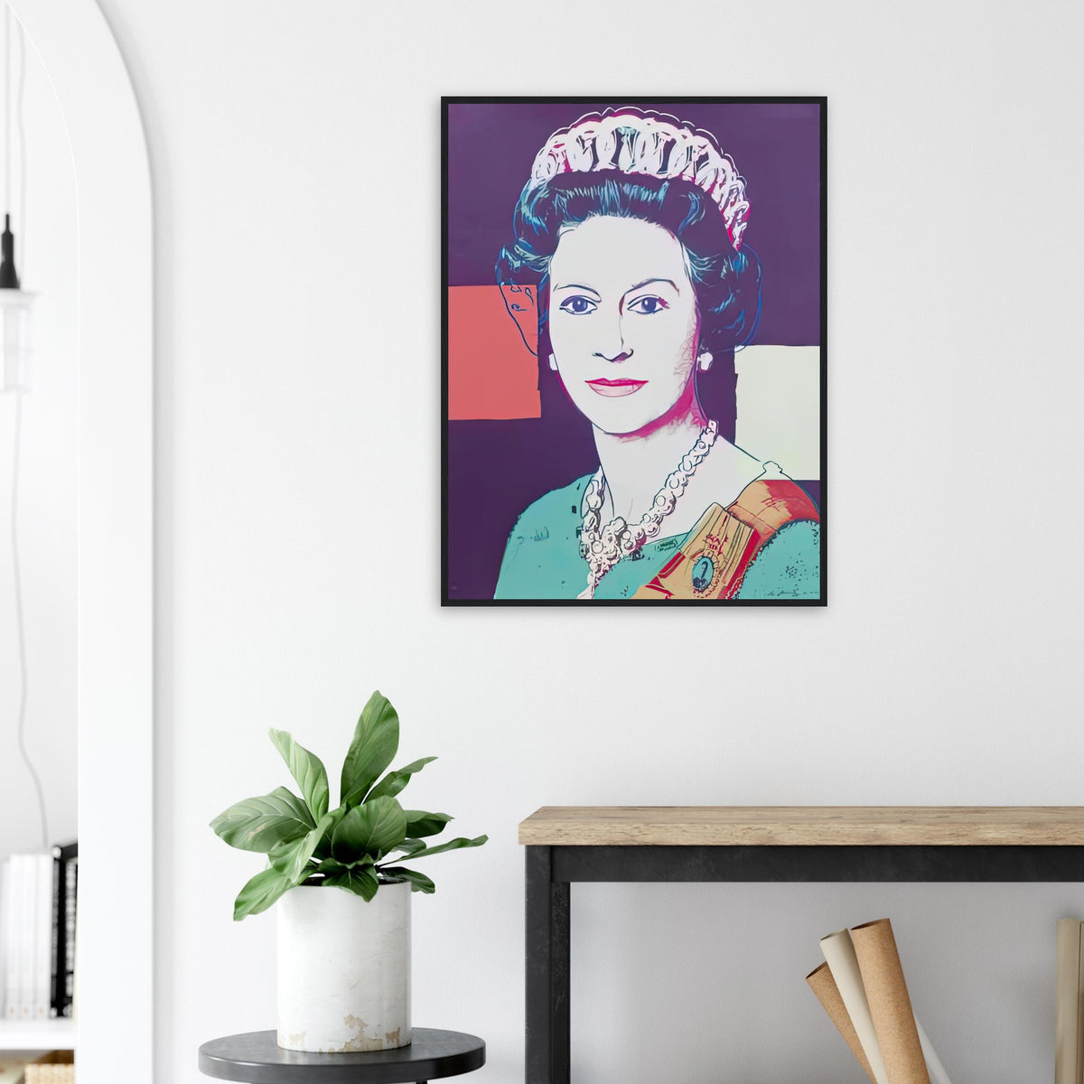 Andy Warhol framed print depicting a pale frontal face and detailed royal jewellery are set against blue, pink and red geometric fields; The Reigning Queens portfolio presented four women who held ruling power in their own right: Elizabeth