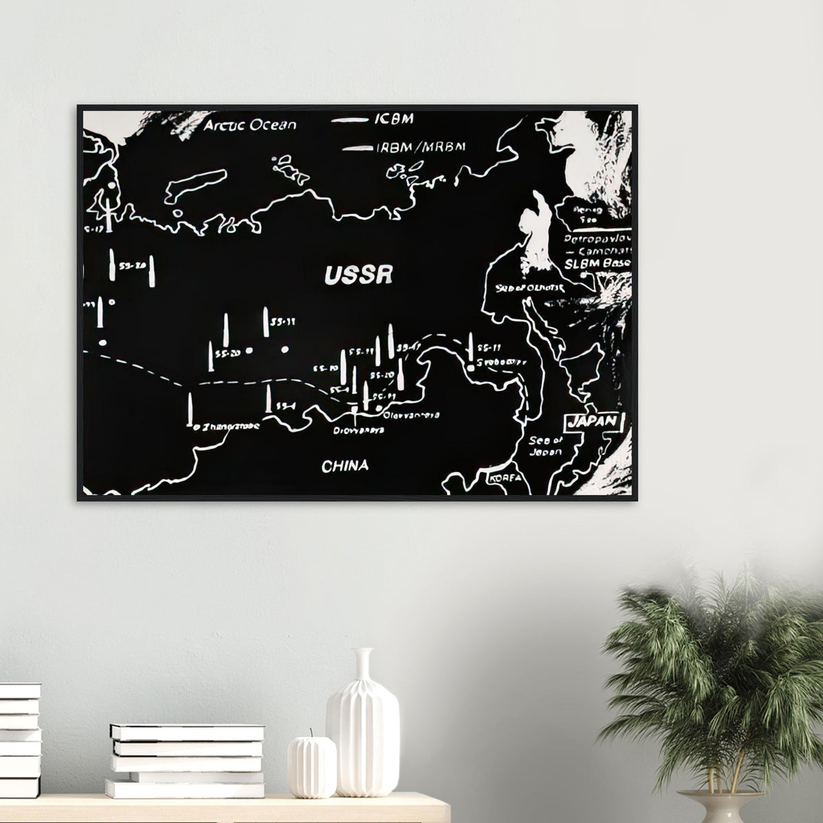 Andy Warhol framed print depicting cartographic outlines and strategic map markings, a detail that connects the composition to its broader artistic subject