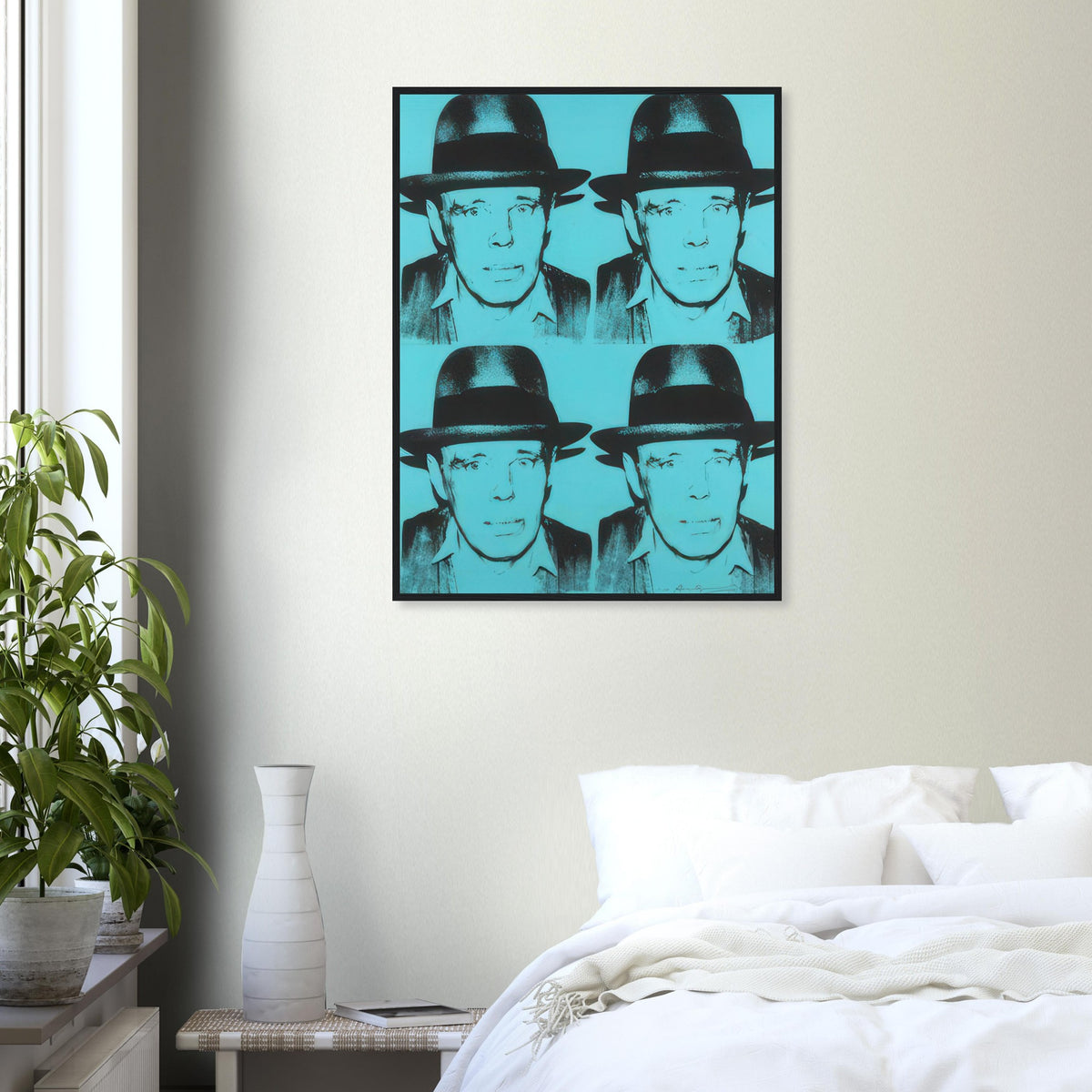 Andy Warhol framed print depicting a 2-by-2 arrangement repeats the felt-hatted face; black forms sit against cyan blue, producing a relatively restrained portrait; Warhol portrayed fellow artist Joseph Beuys after photographing him in 1979