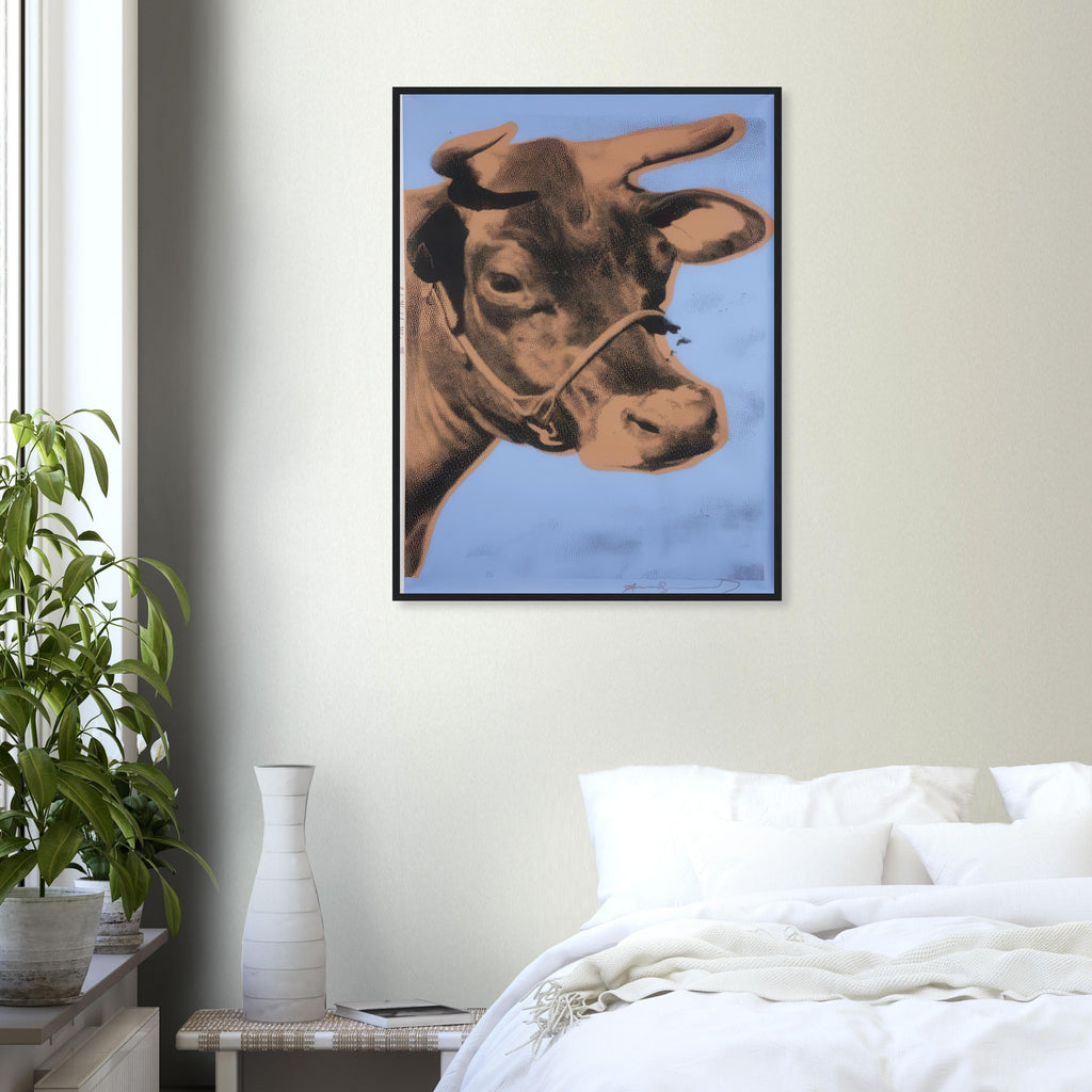 Andy Warhol framed print depicting the cow’s face becomes a bold graphic presence, replacing the gentle mood of traditional animal painting with irreverent visual impact