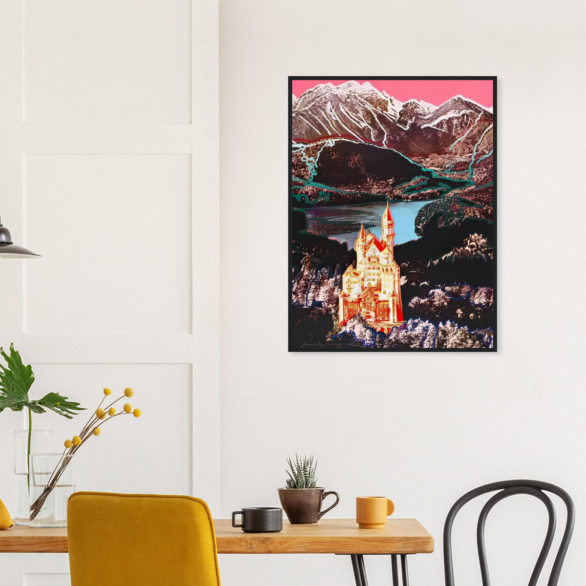 Andy Warhol framed print depicting the Bavarian castle glows in orange-red and yellow above a lake, while blue outlines and a bright-pink sky dominate the Alpine setting; Warhol’s image of Neuschwanstein Castle translates a heavily photographed Bavarian landmark into Pop Art