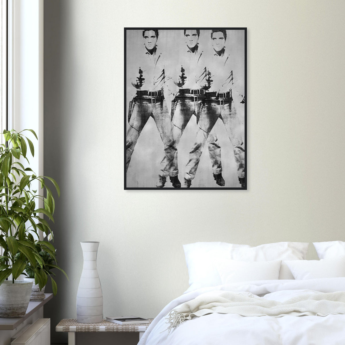 Andy Warhol framed print depicting a repeated standing figure in Western costume amplifies the rhythm of the pose, blending the visual language of a publicity still with a repeated screen image; Warhol’s multiple-Elvis imagery grew from publicity photographs of Elvis Presley in his Western-film