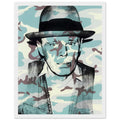 Andy Warhol framed print depicting beuys faces the viewer wearing his characteristic brimmed felt hat; Warhol portrayed fellow artist Joseph Beuys after photographing him in 1979, white frame, 27x35 cm / 11x14″