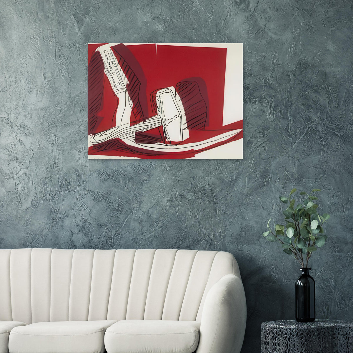 Andy Warhol poster depicting the industrial hammer and curved sickle as emphatic, intersecting shapes, a detail that connects the composition to its broader artistic subject