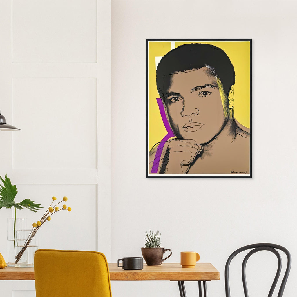 Andy Warhol framed print depicting ali turns toward the viewer with a raised fist; yellow, purple and white colour accents sharpen his focused gaze; The Muhammad Ali portfolio was developed from Warhol’s photographs of the celebrated boxer after sports