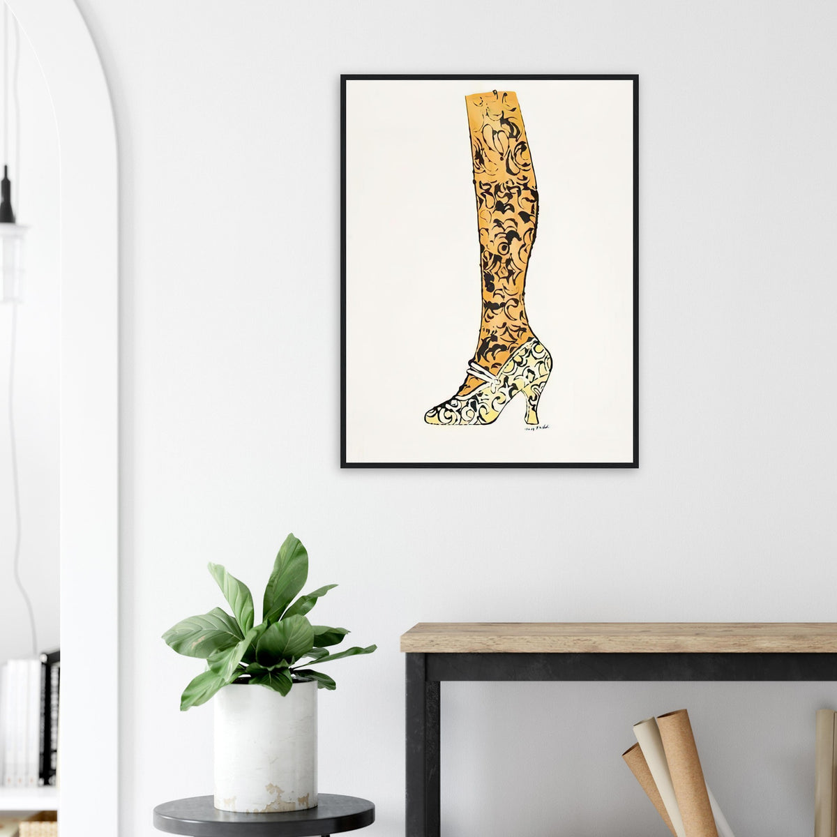 Andy Warhol framed print depicting a bright yellow high heel, golden-toned leg and black paisley decoration make an elegant fashion drawing feel witty and theatrical; Shoe and Leg comes from Warhol’s commercial-illustration era and the witty La Recherche du Shoe Perdu