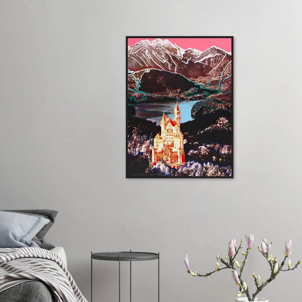 Andy Warhol framed print depicting the Bavarian castle glows in orange-red and yellow above a lake, while blue outlines and a bright-pink sky dominate the Alpine setting; Warhol’s image of Neuschwanstein Castle translates a heavily photographed Bavarian landmark into Pop Art